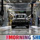 A photo of a Mercedes factory line with an SUV being constructed.